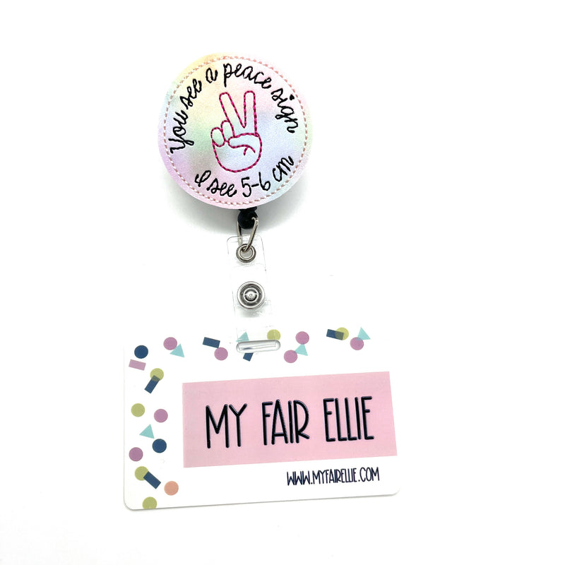 You see a peace sign I see 5-6 cm // Badge Buddy