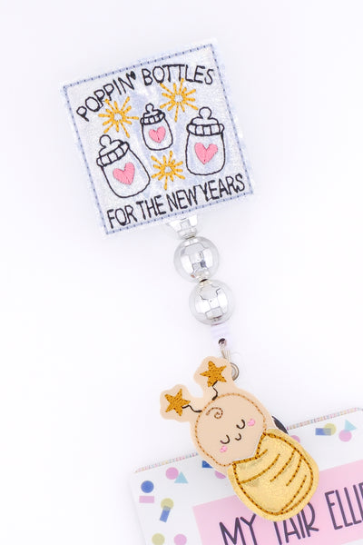 Poppin' Bottles for the New Years // Swaddle Baby // Badge Buddy