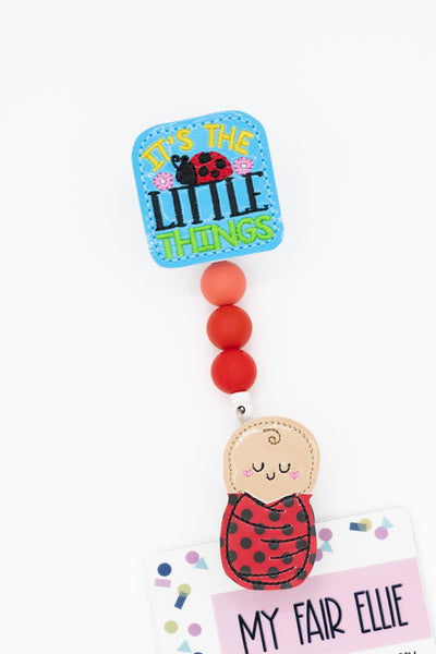 It's the Little Things // Lady Bug Swaddle Baby // Badge Buddy