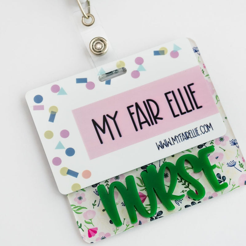 White Floral Badge Backer with Green Peachy Font