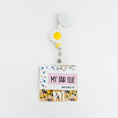 Yellow Floral Badge Backer with White Peachy Font