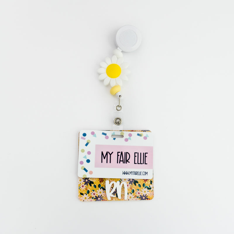 Yellow Floral Badge Backer with White Peachy Font